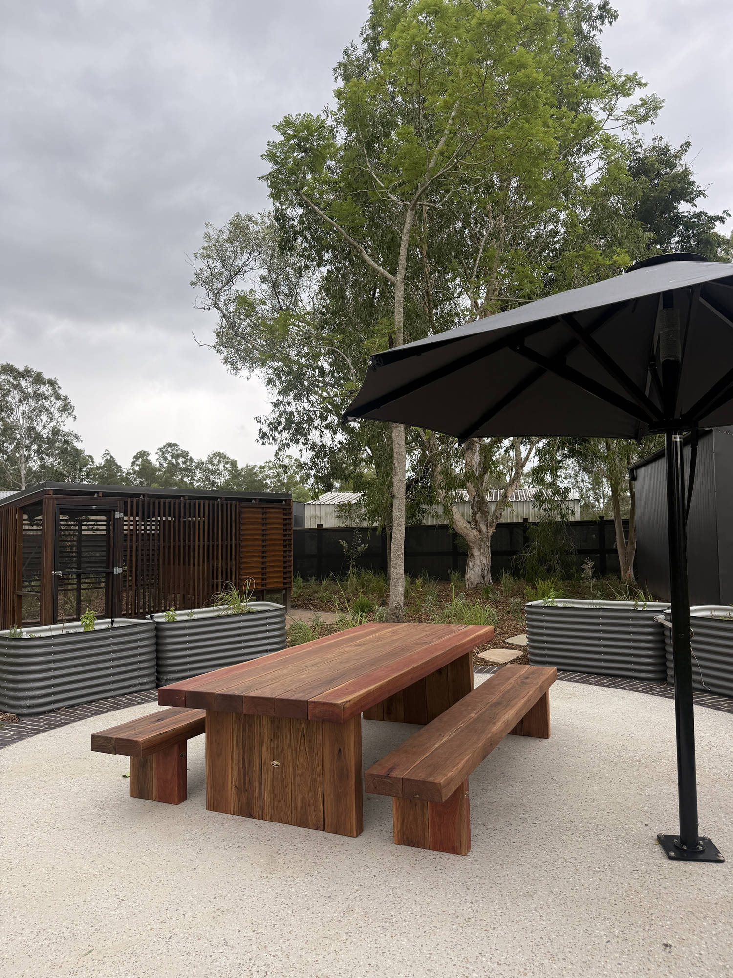 Iron King table setting in spotted gum, handcrafted by TK Garden Heritage
